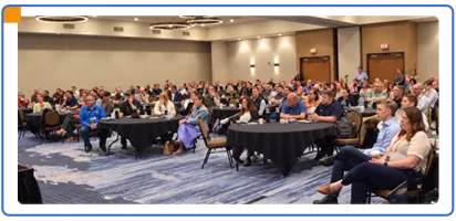 paradigm-annual-conference-audience-listening-to-speaker-412x200